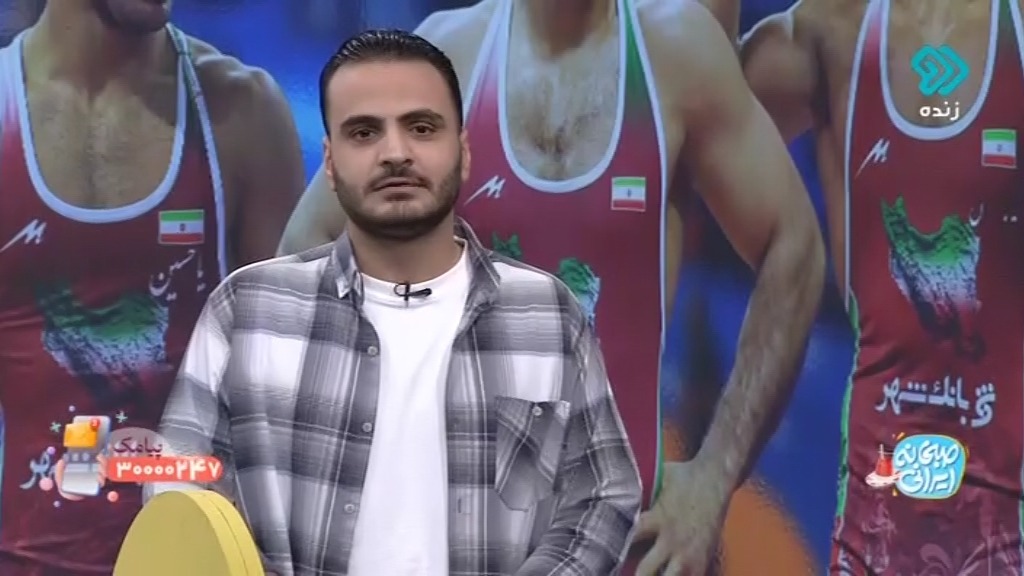 کنایه مجری شبکه دو به بازیکنان استقلال و مقایسه با قهرمانان کشتی ایران